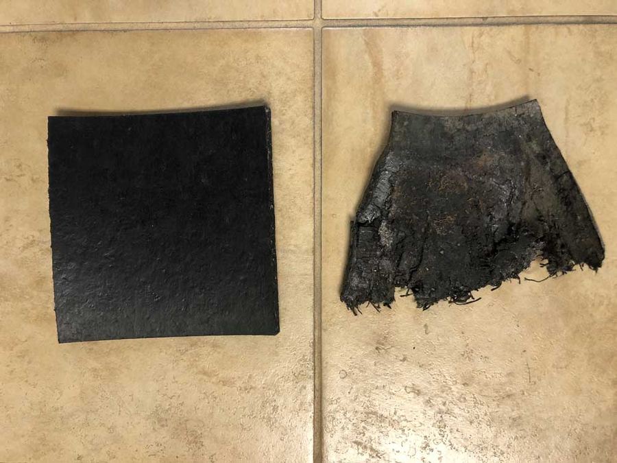 A new bearing pad beside a failed, crumbling one