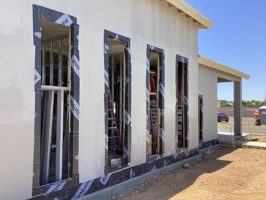 Air barrier installed around window openings on a new commercial building